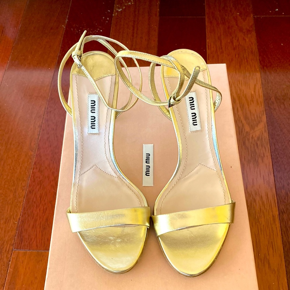 Miu miu metallic strap heel.
